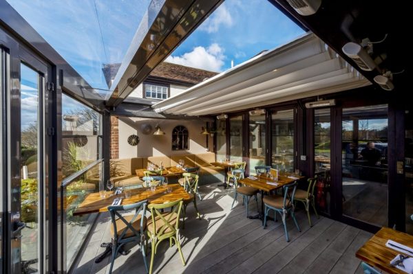 Outdoor Covered Seating Area with an retractable roof pergola